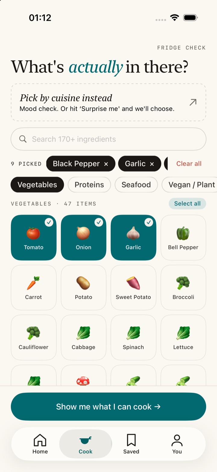 SoloCook's ingredient picker: a search field above a grid of tappable ingredient tiles, with tomato, onion and garlic selected.